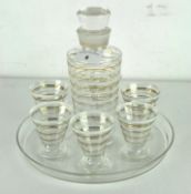 An Art Deco glass cocktail serving set with six matching glasses and tray,