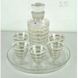 An Art Deco glass cocktail serving set with six matching glasses and tray,