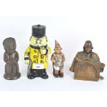 A group of four 20th century money boxes in the shape of figures,