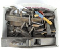 A collection of vintage tools including drills, planes,