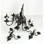 An eight branch moulded metal chandelier, painted in black, height 57cm,