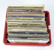 A large collection of mostly 1980s vinyl records including Genesis, Thriller, Blondie, Supertramp,