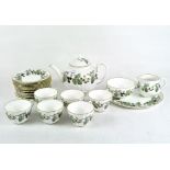 A six person Royal Worcester tea set decorated with branches of flowering and fruiting blackberries