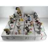 A collection of twenty nine Wade ceramic figures, various designs and models,