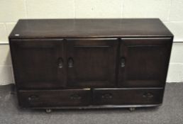 An Ercol dark stained elm Windsor sideboard, mid-century,