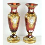 A pair of large cranberry glass vases,