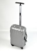 A Samsonite suitcase with extending handle,