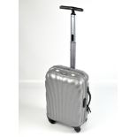 A Samsonite suitcase with extending handle,