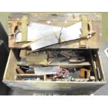 A large vintage wood workbox containing various tools including saws, drills, planes, files,