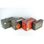 A group of four metal ammunition cases,