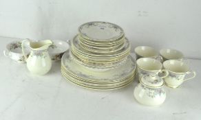 A Royal Doulton 'Juliet' tea set, including tea cups, saucers, dinner plates and more,