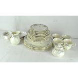 A Royal Doulton 'Juliet' tea set, including tea cups, saucers, dinner plates and more,