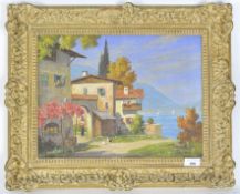 A 20th century oil on canvas of a Mediterranean scene of houses on the edge of a lake, signed P...