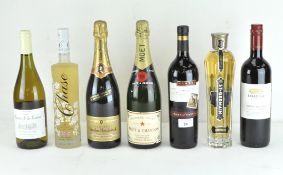 Seven vintage bottles of alcohol, including a bottle of Moet & Chandon premiere cuvee,