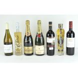 Seven vintage bottles of alcohol, including a bottle of Moet & Chandon premiere cuvee,