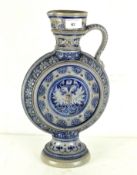 A continental highly decorated single handled pouring vessel, stamped mark to base,