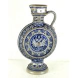 A continental highly decorated single handled pouring vessel, stamped mark to base,