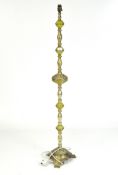 A 20th century gilt metal standard lamp, with moulded decoration, on tripod base, missing shade,