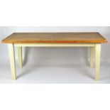 A 20th century oak kitchen table, the square tapered legs painted cream,