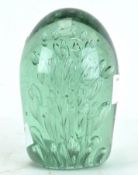 A late 19th/early 20th century light green glass dump paperweight,