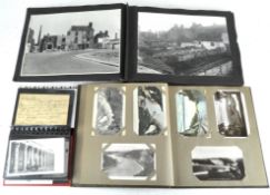 A collection of 20th century photographs and postcards, spread over three albums,