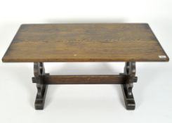 A 20th century rectangular oak coffee table with lyre shaped supports,