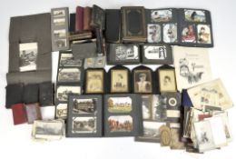 A large collection of leather bound books, Victorian photographs and postcards,