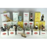 A collection of nineteen Wade ceramic figures, various designs and models,