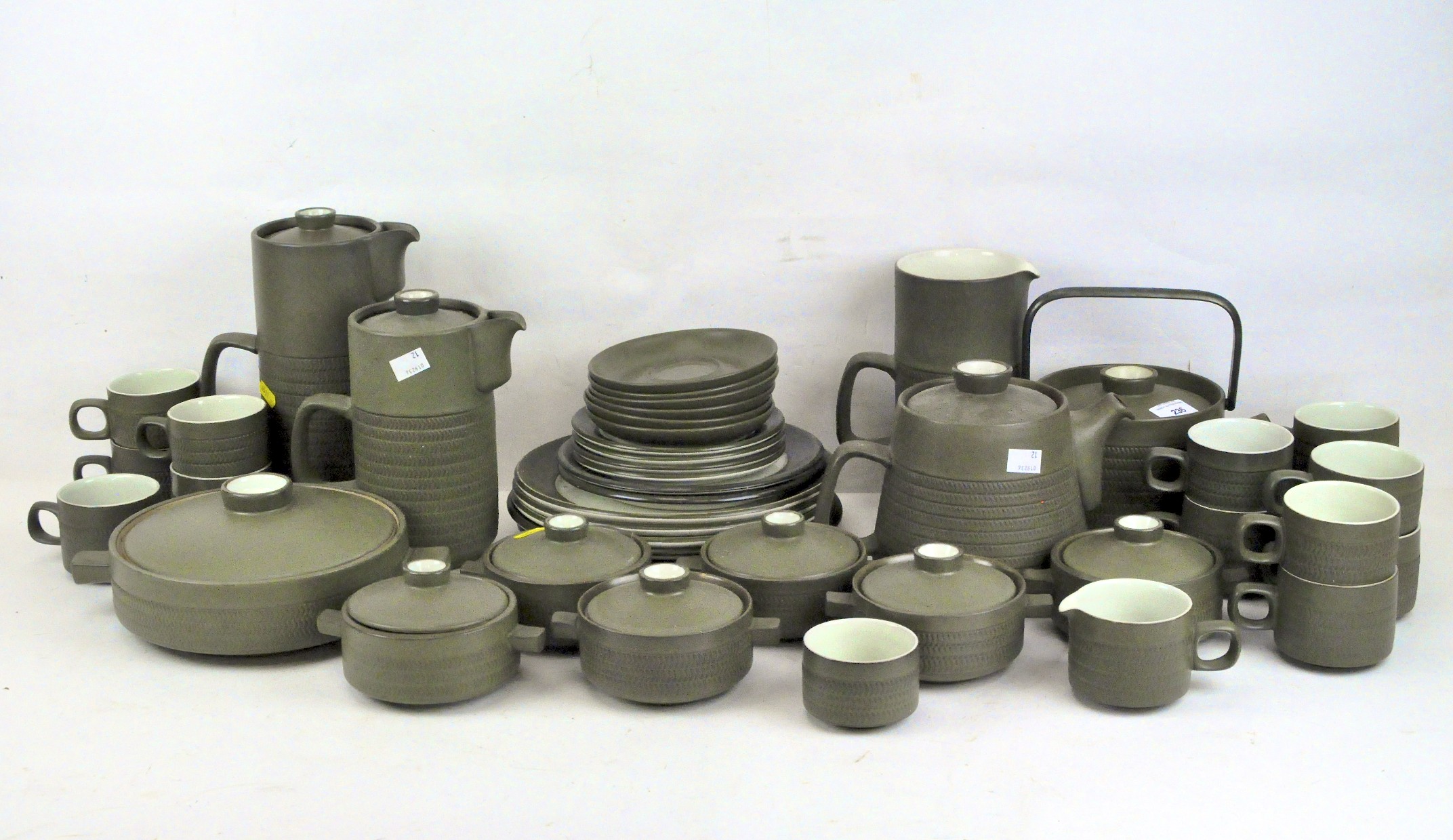 A Denby part tea and dinner service, in dark green glaze with light green interiors,