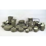 A Denby part tea and dinner service, in dark green glaze with light green interiors,