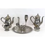 A selection of silver plated wares including a circular tray, salt and pepper pots and spill-vase