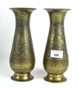 A pair of Islamic style brass vases, engraved with foliate decoration,
