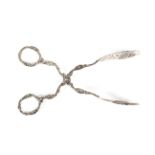 A pair of profusely decorated Swedish white metal tongs,