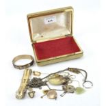 A selection of yellow metal costume jewellery, including chains, hinged bangle, rings,