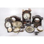 An assortment of Victorian and later mantel clock parts, including wooden and slate bodies,