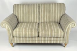 A club style three piece suite, by Parker Knoll, with a two seater sofa and two armchairs,