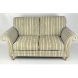 A club style three piece suite, by Parker Knoll, with a two seater sofa and two armchairs,