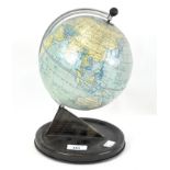 A vintage Chad Valley small globe, on tin base,