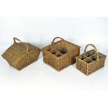 Three vintage wicker baskets, including one fitted for six wine bottles,