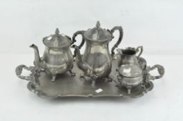 A Victorian silver plated tea service, decorated with scrolling motifs,