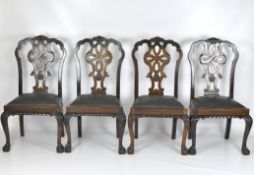 Four 20th century stained wood chairs,