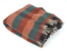 A Scottish woolen Tartan blanket,