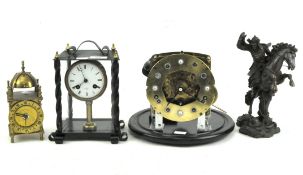 Two skeleton clocks together with another small brass clock and a resin sculpture of a Samurai