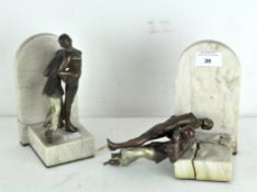 A pair of Art Deco Spelter bookends, depicting dancing couples in period dress, on marble bases,