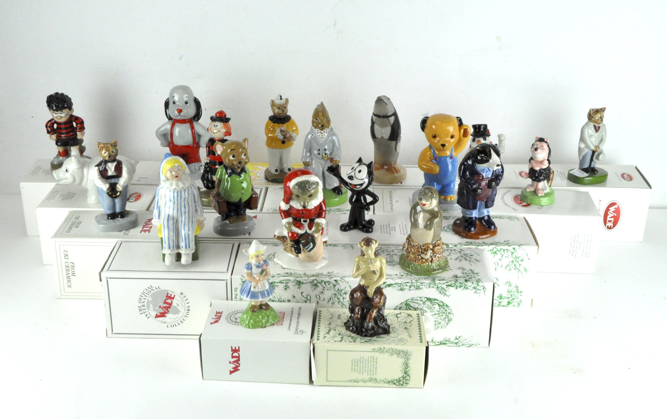 A collection of twenty Wade ceramic figures, various designs and models,