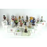 A collection of twenty Wade ceramic figures, various designs and models,