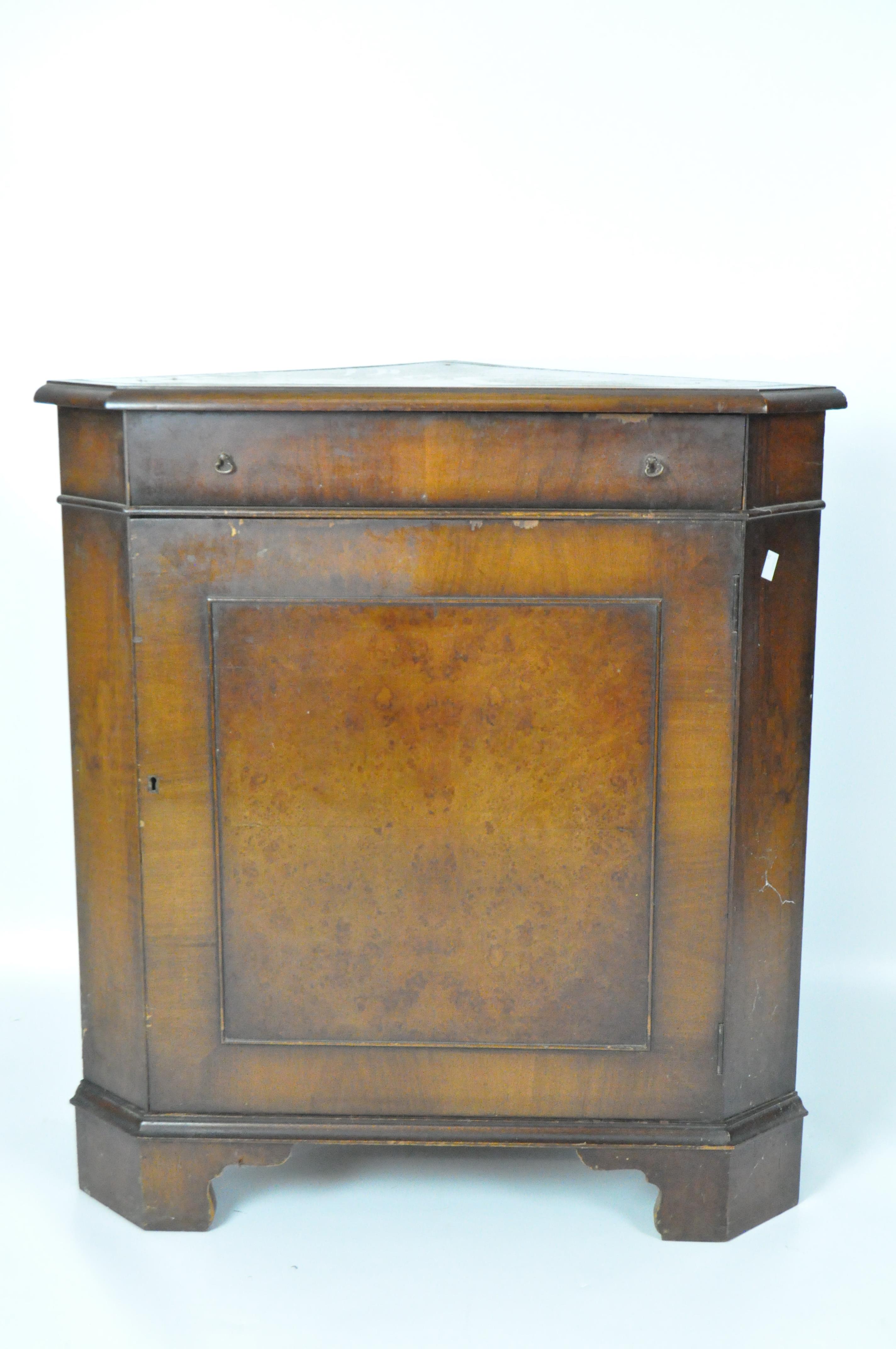 A Victorian mahogany corner cabinet, enclosed by single fielded panel door