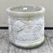 A large stoneware plant pot, moulded with vines,