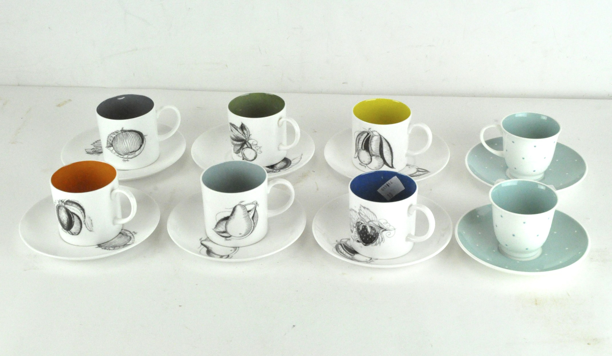 A vintage Suzie Cooper coffee service comprising six cups and saucers decorated with fruits,