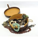 A leather hat box including a selection of vintage costume jewellery, including necklaces,